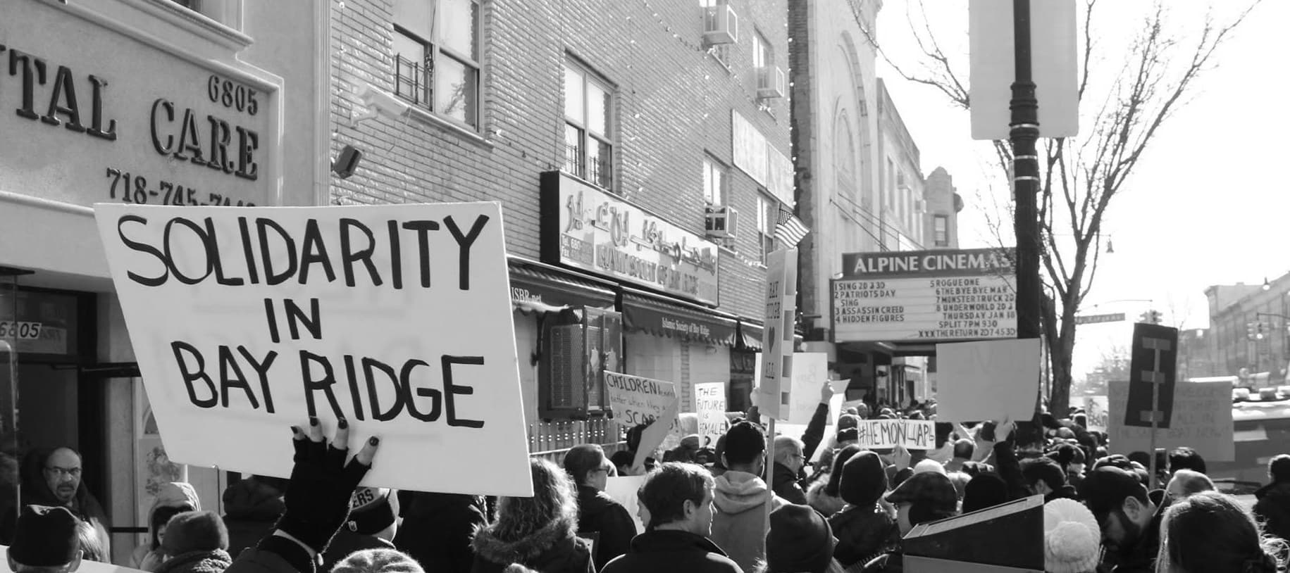 Activists rally at the start of the Martin Luther King, Jr. Day March for Visibility Against Hate in Bay Ridge