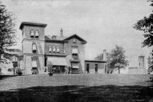 View of Eliphalet Bliss's mansion in Owl's Head Park with his observation tower in the background.